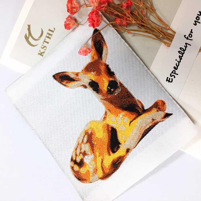 Custom high density giraffe animal woven clothing labels